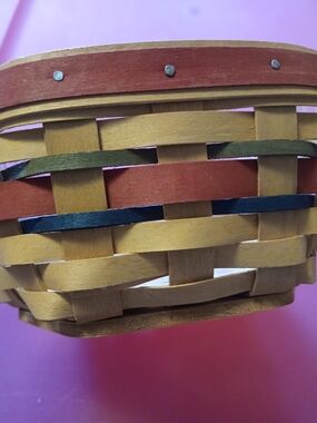Longaberger woven basket with red, green and navy accents